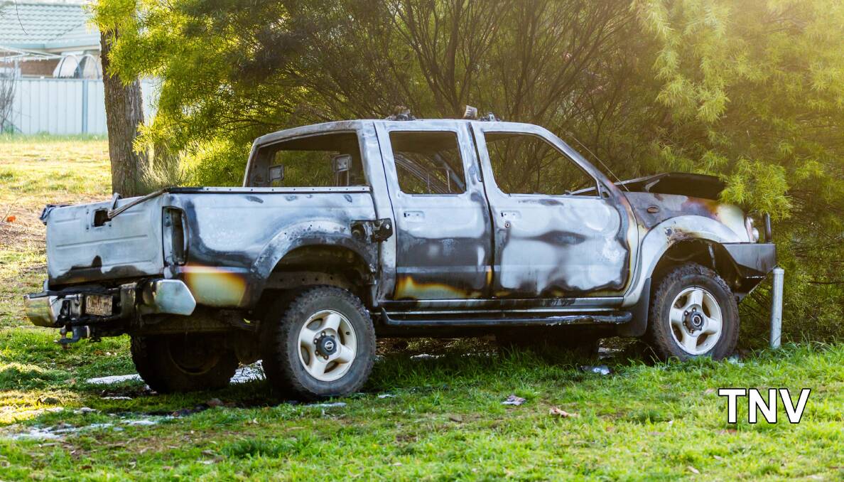 GUTTED: The burned-out car in Cootes Park on Saturday morning. Photo: TROY PEARSON/Top Notch Video. 
