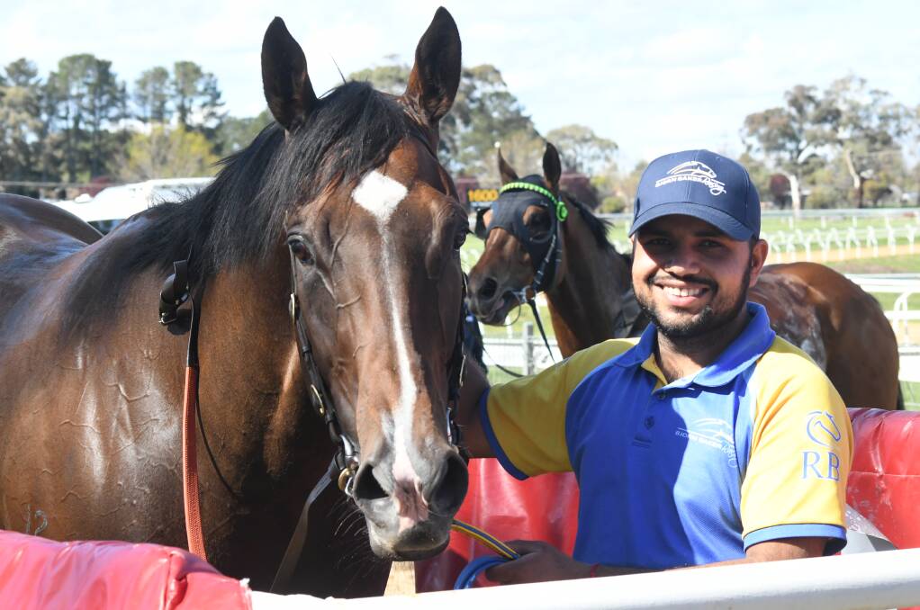 GRINNING FEELING: Tony's Reward poses for the camera along his handler after taking home a win at Towac Park. Photo: CARLA FREEDMAN. 