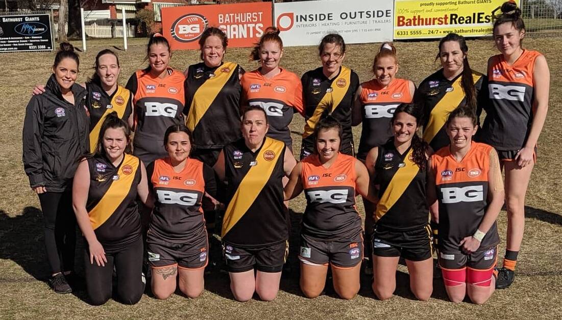 SISTERS IN ARMS: Jayarna Kay (far left) with Tigers and Giants players last weekend ahead of their clash. Photo: SUPPLIED. 