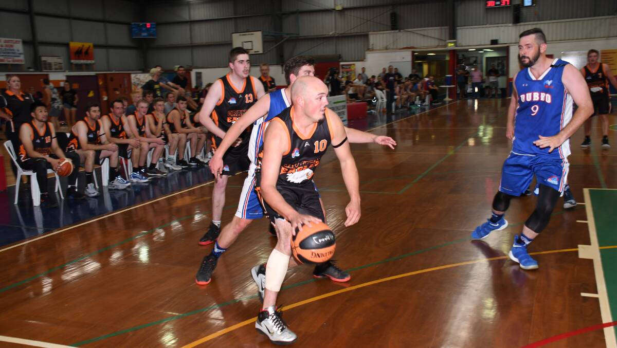 GO HARD: Ben Grundy drives at the ring in the Eagles' first game. Photo: AMY McINTYRE