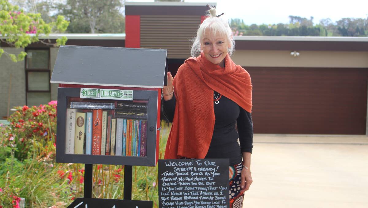 HOME FOR BOOKS: Sandra Russell with the new street library out the front of her Green Lane home. Photo: MAX STAINKAMPH