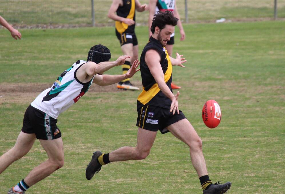 UTILITY: Jaxon Mumme breaks out of defence in the CWAFL grand final. Photo: MAX STAINKAMPH. 