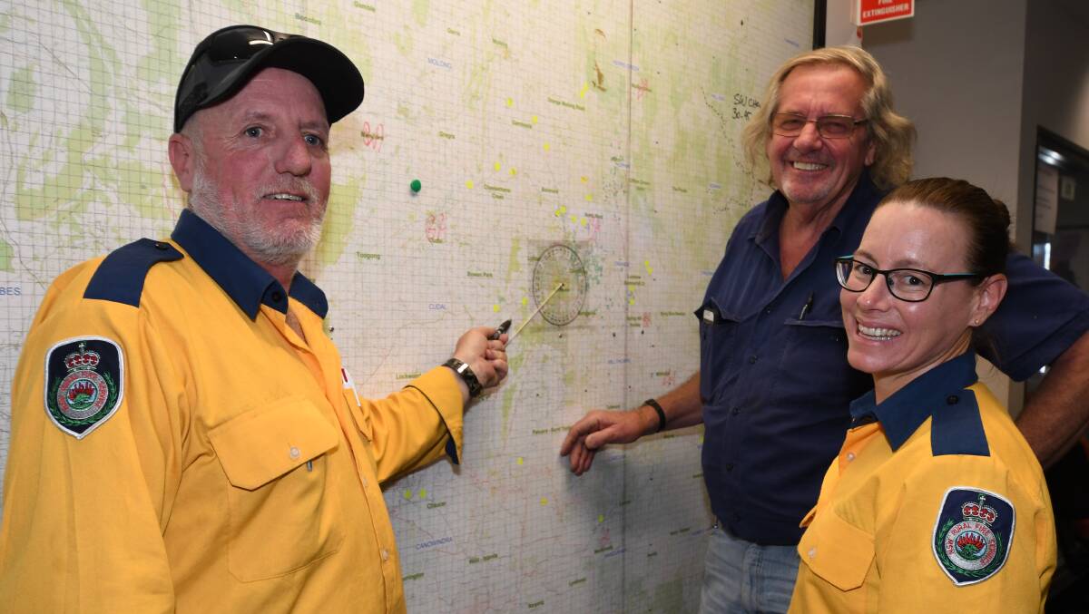 READY TO GO: Darrell Wicks, Geoff Olde and Katrina Smith at the NSW RFS Canobolas Zone headquarters doing training exercises during last fire season. Photo: JUDE KEOGH