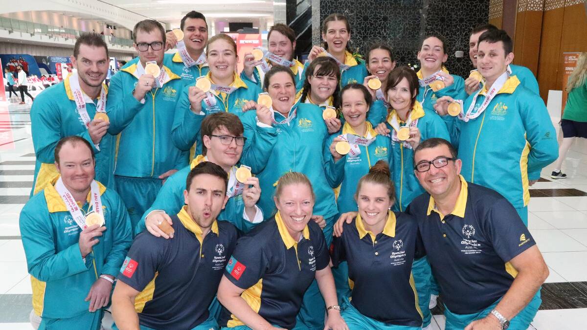 THAT WINNING FEELING: Carmen Dederer (front, second from left) with the rest of the Special Olympics basketball players and coaching staff in Abu Dhabi. Photo: SPECIAL OLYMPICS AUSTRALIA. 