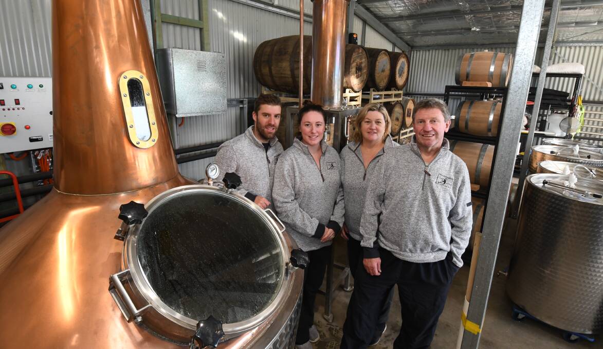 FAMILY AFFAIR: Nic and Kylie Smith and Dot and Tony Jones have launched Jones and Smith Distillery in Spring Hill. Photo: JUDE KEOGH (file photo taken before social distancing)