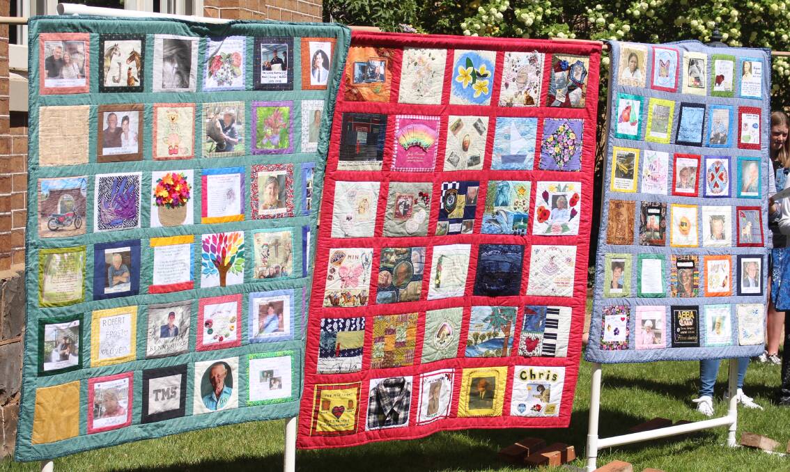 The three quilts put together over the last two years, with the red quilt from 2018 and the two on either side from 2019. 
