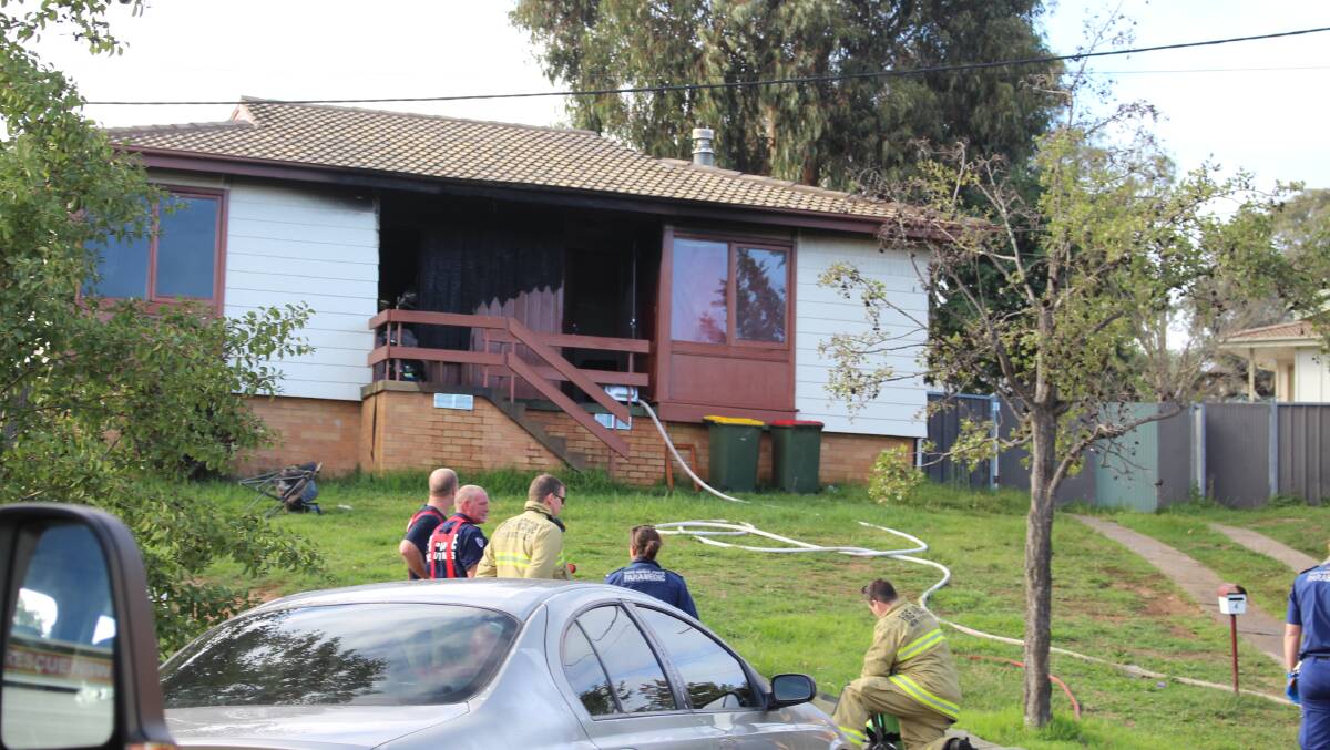 BURNED OUT: The house on Lewana Place which emergency services were called to on Thursday. Photo: MAX STAINKAMPH