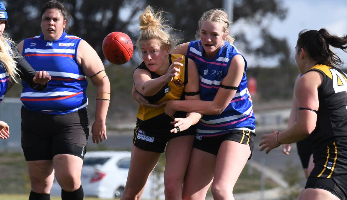 TOUGH CONTEST: Erika Lindsay donned a Parkes jumper for the day and didn't let teammate Sal Davidson escape this contest easily. Photo: JUDE KEOGH
