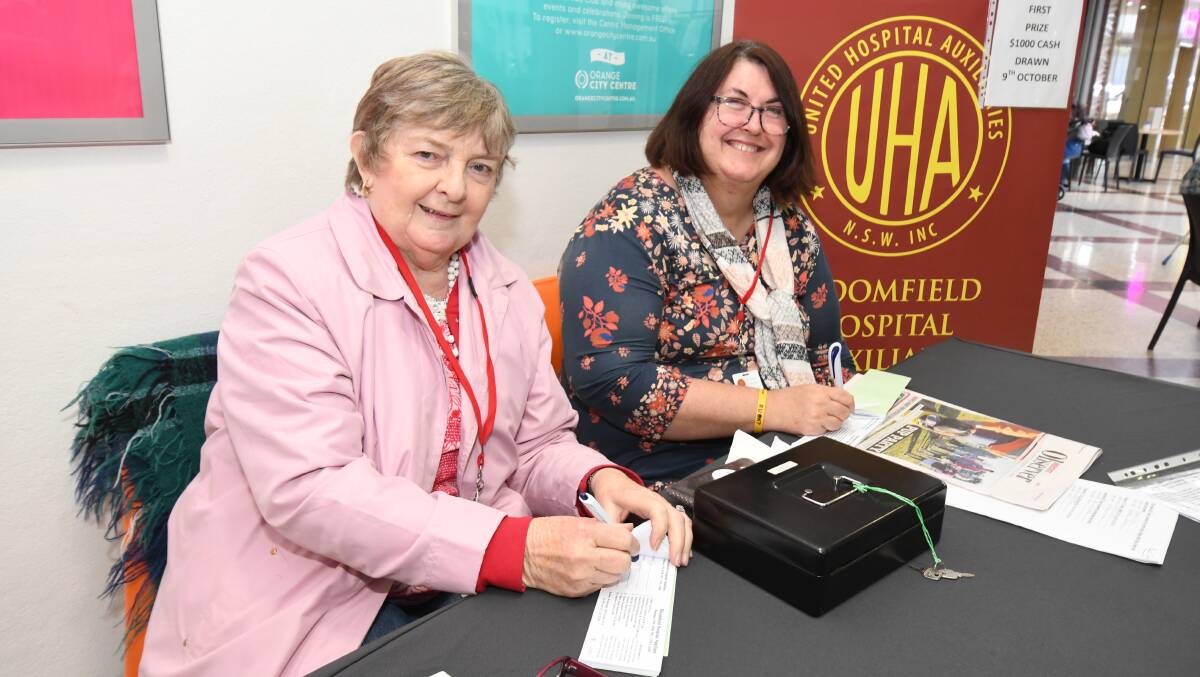 WORKING HARD: Julie Slattery and Karen Johnston selling raffle tickets for the Bloomfield Hospital Auxiliary in Orange City Centre on Thursday. Photo: JUDE KEOGH