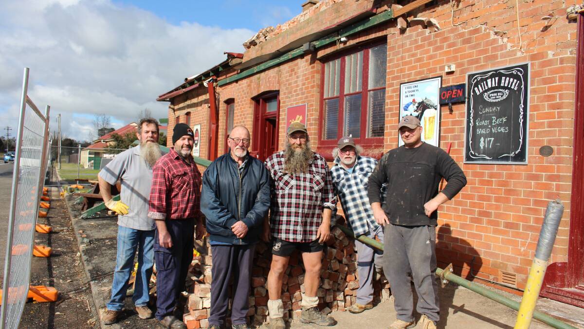 AT THE PUB: Shane Hatton, Grant Millan, Garry Sampson, Simon Oborn, Mark Amos and Kayo Hildenbuetel out the front of the Railway Hotel in Spring Hill. Photo: MAX STAINKAMPH