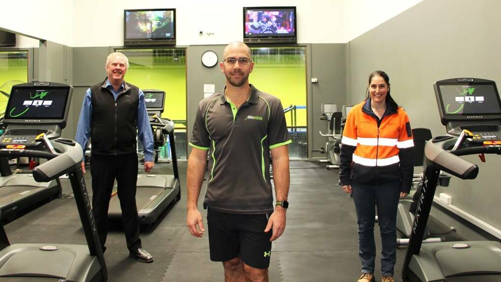 HELPING HANDS: Fitness Perfection Owner Nickolas Gray (front) with Business Beyond the Curve committee member Bruce Reynolds and Alison Farrar. Photo: SUPPLIED