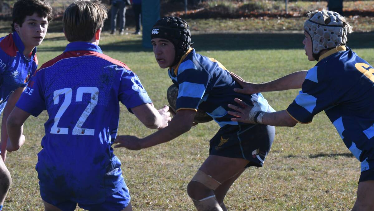 IN TRAFFIC: Douglas Philipson looks to get away in Central West's game against Manly on Sunday. Photo: CARLA FREEMAN 0610cfrugby3. 