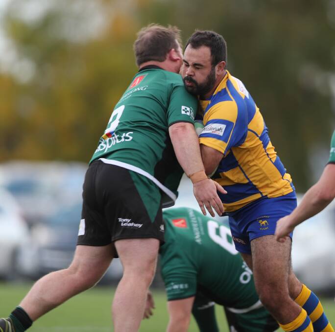CLASH OF TITANS: Bulldogs captain Peter Fitzsimmons collides with Emus' Steve Fergus during their round four clash at Anne Ashwood Park earlier this season. Emus will be looking to reverse the 21-15 result. Photo: PHIL BLATCH