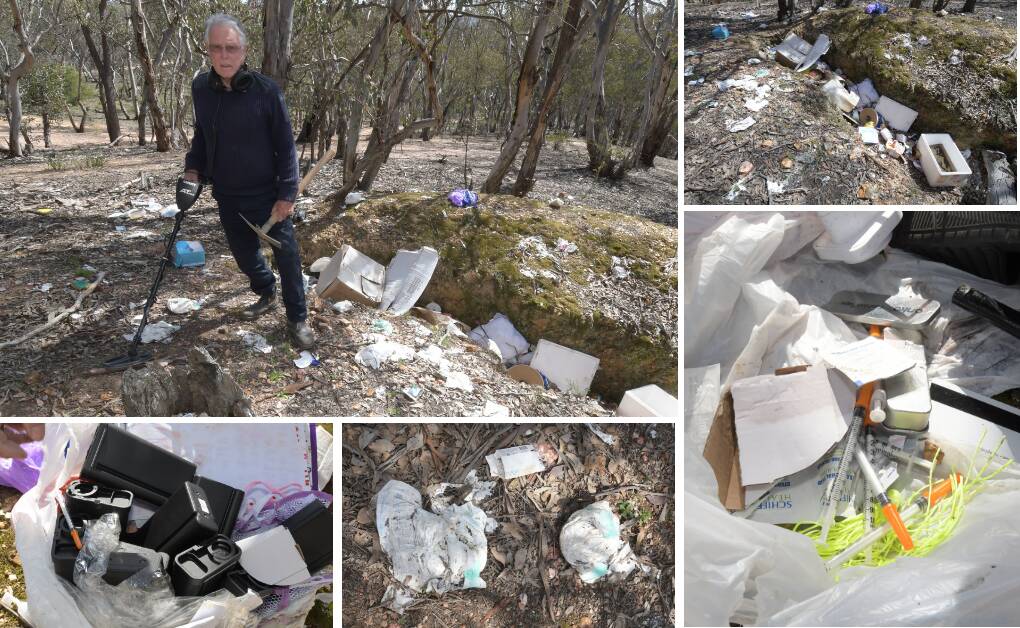 TRASHED THE JOINT: Mike Fitzgerald and his metal detector standing among the pile of rubbish he found at Ophir this week. Photos: JUDE KEOGH