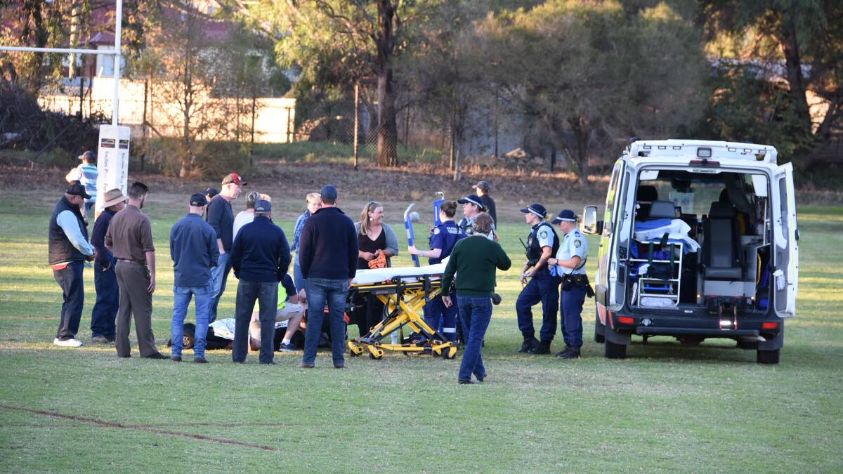 THE MOMENT: Emergency services tend to Josh Tremain at the Cowra Rugby Ground on May 18 last year. Photo: SUPPLIED. 