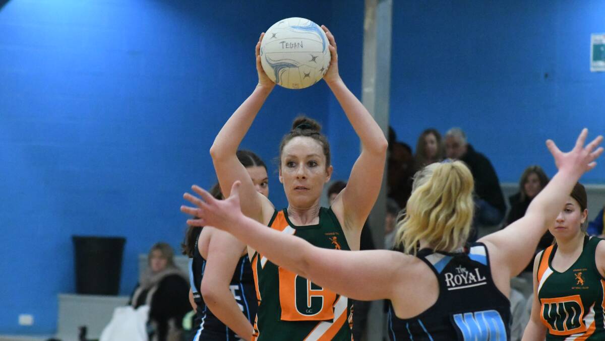 CAUGHT IN THE MIDDLE: Orange City centre and OHS coach Tegan Dray will be torn as the Hornets take on her side in the ONA grand final on Saturday. Photo: JUDE KEOGH