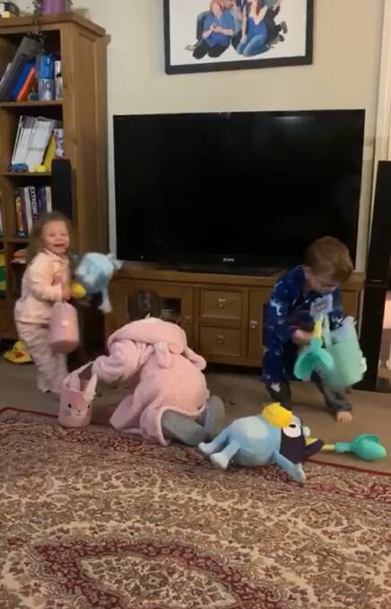 MADNESS AND CHAOS: The three West children running around in their Easter egg hunt on Sunday. Photo: SUPPLIED
