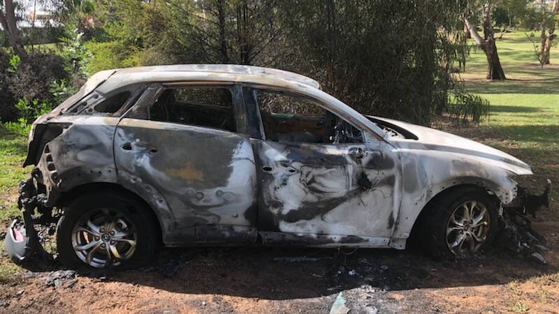 Virginia Green's burned-out car in Cootes' park. It's the second car burned there this month. 