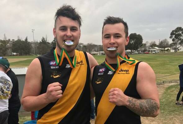 BROTHERS IN ARMS: Chris and Michael Rothnie after winning the Central West AFL grand final last year.