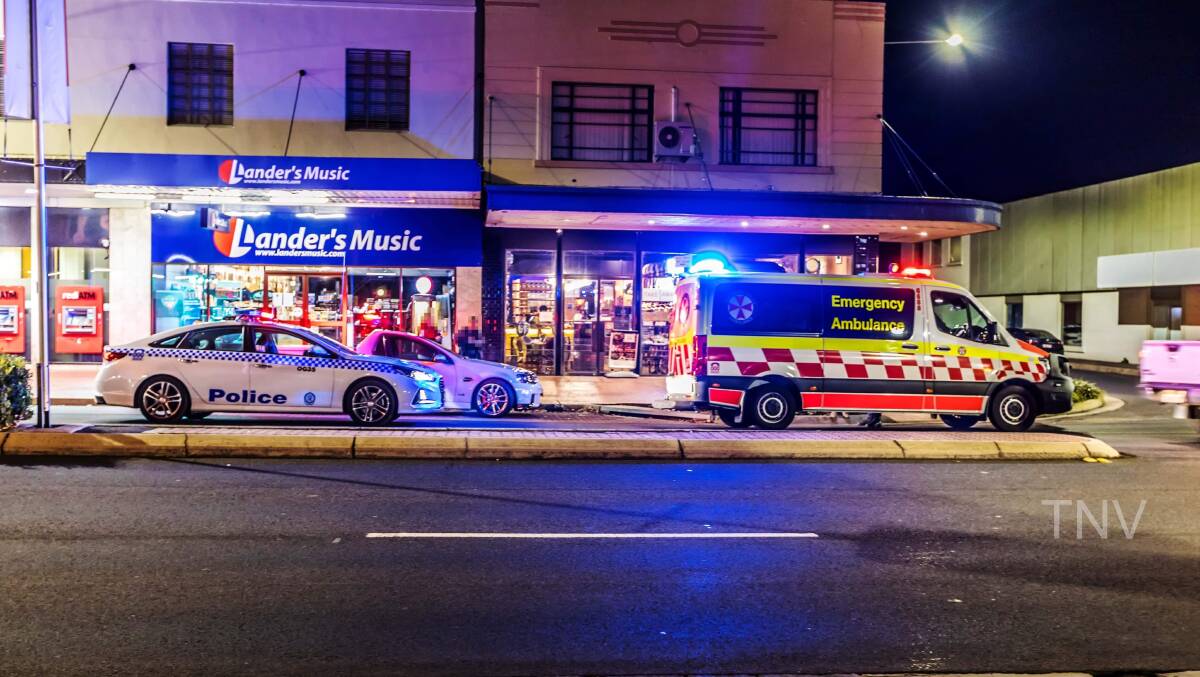 LEFT ROADSIDE: Emergency services responding to the incident along Summer Street on Monday night. Photo: TROY PEARSON/TOP NOTCH VIDEO