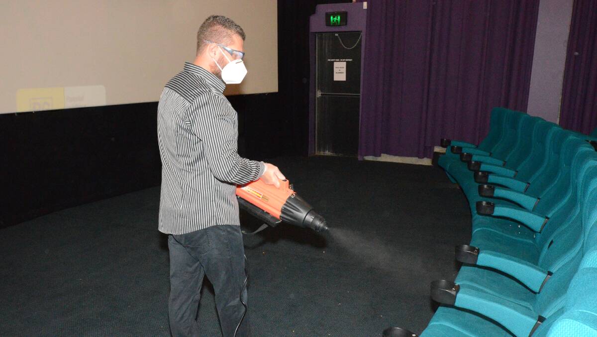 WHO YOU GONNA CALL?: Odeon 5's Craig Murphy using the cinema's new 'Ghostbusters' machine to clean seats. Photo: JUDE KEOGH