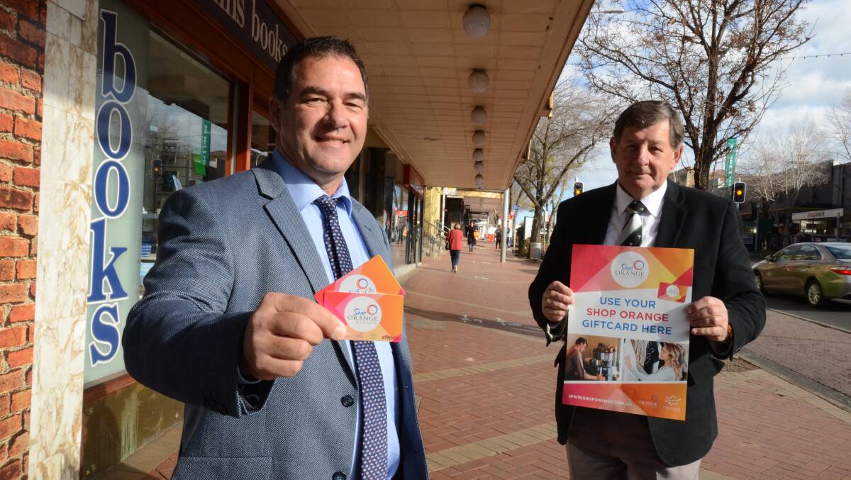 WIN A PRIZE: Cr Tony Mileto and mayor Cr Reg Kidd are encouraging businesses to sign up to make the most of gift cards. Photo: JUDE KEOGH