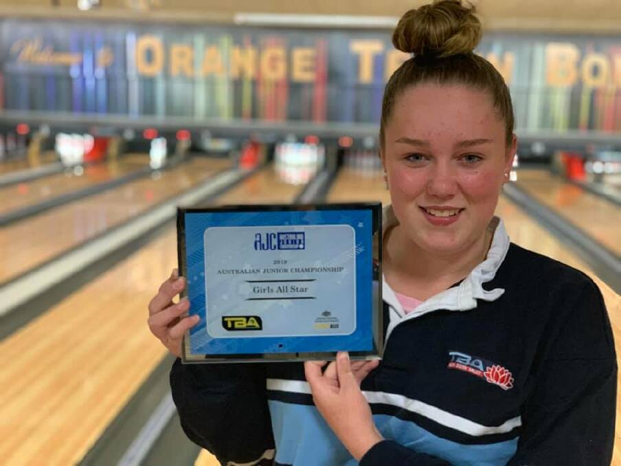 YOUNG GUN: Micaylah Downey with the President's Shield All-Stars Award plaque. Photo: SUPPLIED. 