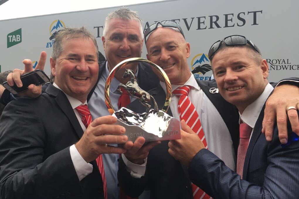 MASSIVE GRINS: Central West co-owners of Redzel - Frank Weymouth, Scott Rayner, Stuart Milne and Brett Ogston - with some of the silverware they picked up over the weekend. Photo: SUPPLIED. 