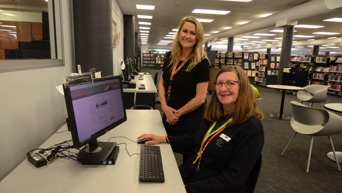 BACK ONLINE: Orange library's Tam Wilson and Cecilia Lawler. The computers are now back open to the public after being shut down due to social distancing laws. Photo: JUDE KEOGH