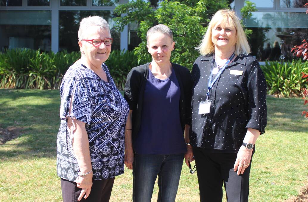REACHING OUT: Koorawatha's Mary Gee, Bernadette Daniels and Western Care Lodge's Jan Savage on Thursday. Photo: MAX STAINKAMPH
