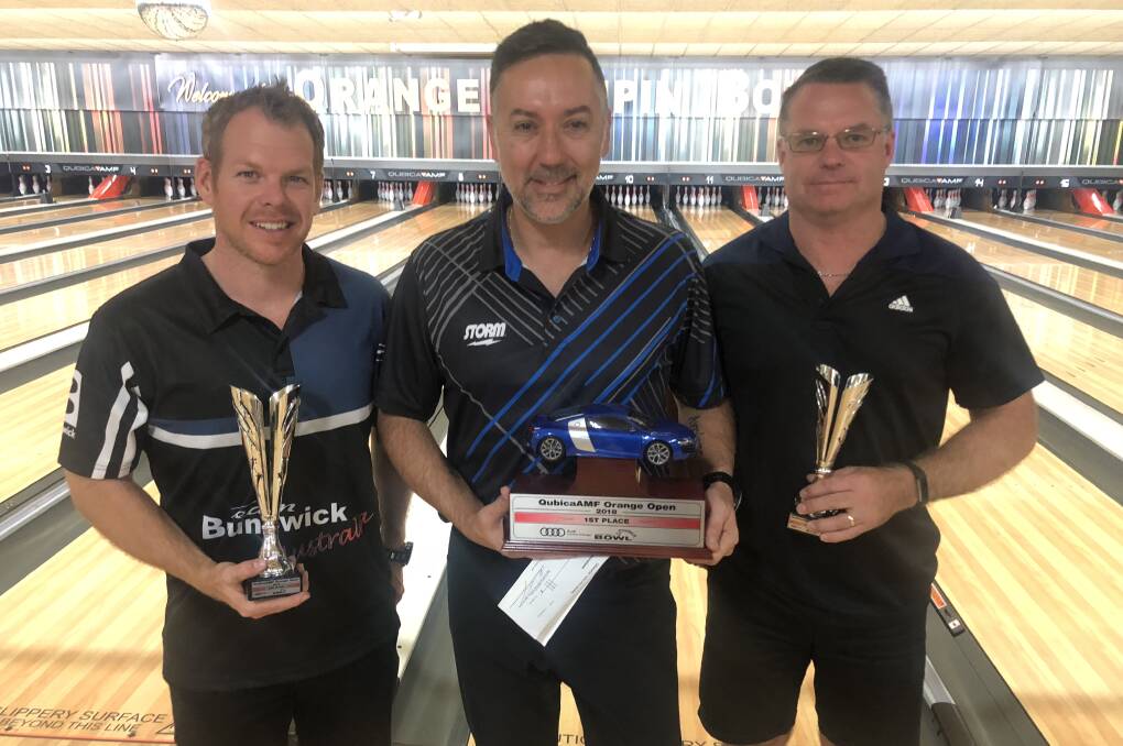 THE TOP THREE: Robert Townsend, George Frillingos and Mathew Francis with the spoils of their victories on the weekend at Orange Tenpin Bowl. Photo: SUPPLIED. 