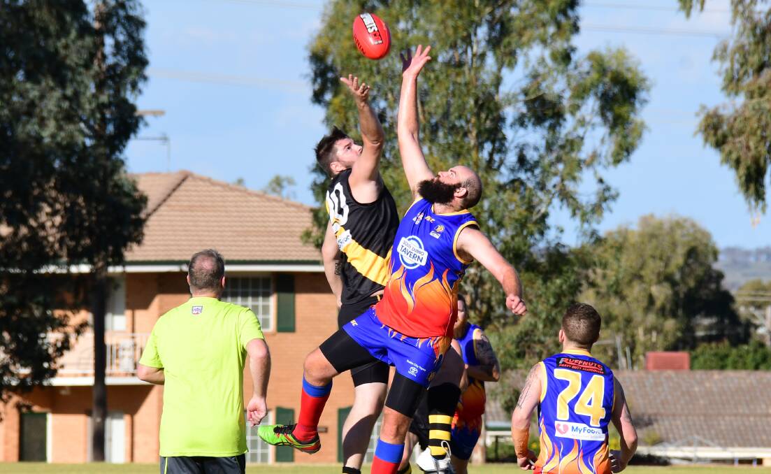 AERIAL BATTLE: Caleb Campbell and Tom Skinner in the ruck last season. The AFLCW still doesn't have a concrete timeframe for a return.