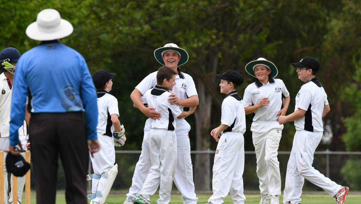 GOT HIM: The Mitchell side were all smiles when celebrating taking a wicket in the under-13 tournament in 2018. Photo: JUDE KEOGH
