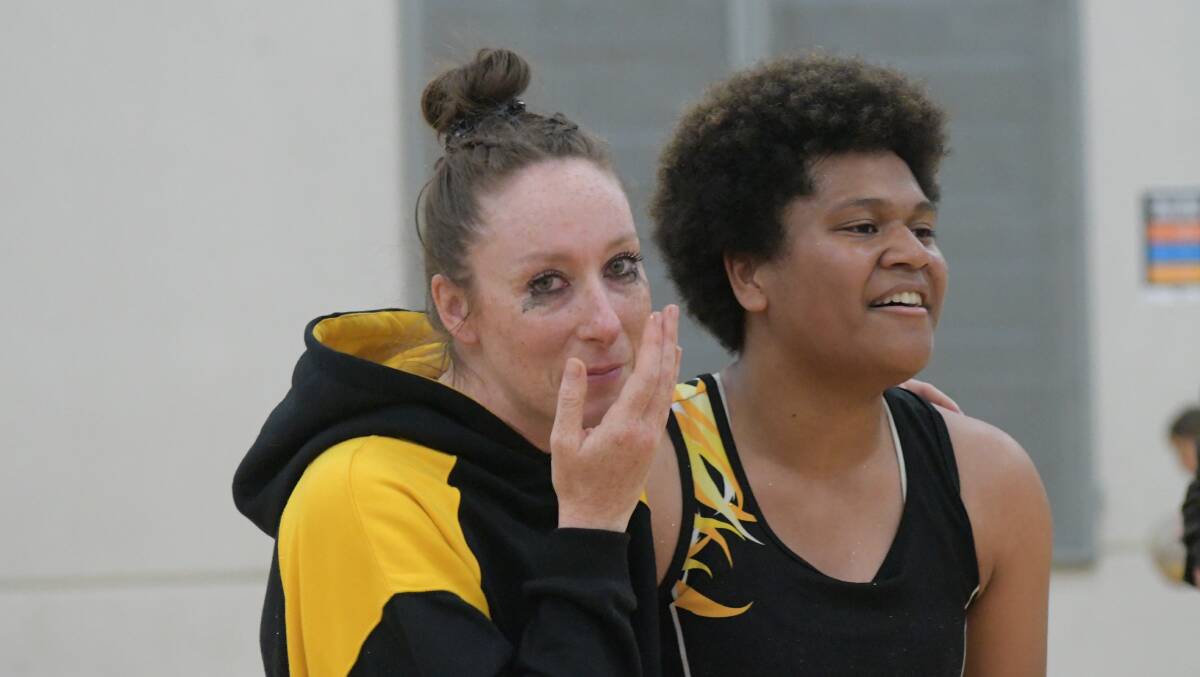 OVERJOYED: OHS Hornets coach Tegan Dray with her side's captain Tabua Tuinakauvadra after the final buzzer. Photo: JUDE KEOGH