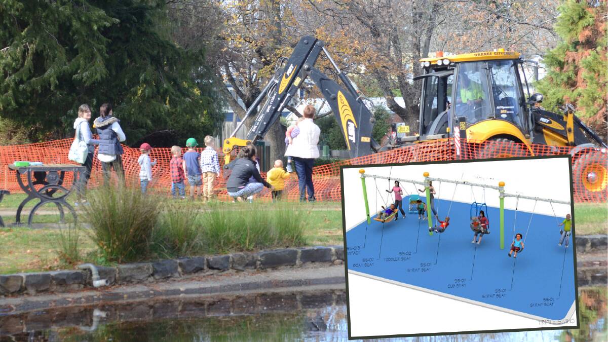 UPGRADE COMING: Parents and children look at machinery replacing the swing set in Cook Park on Wednesday. Photo: JUDE KEOGH