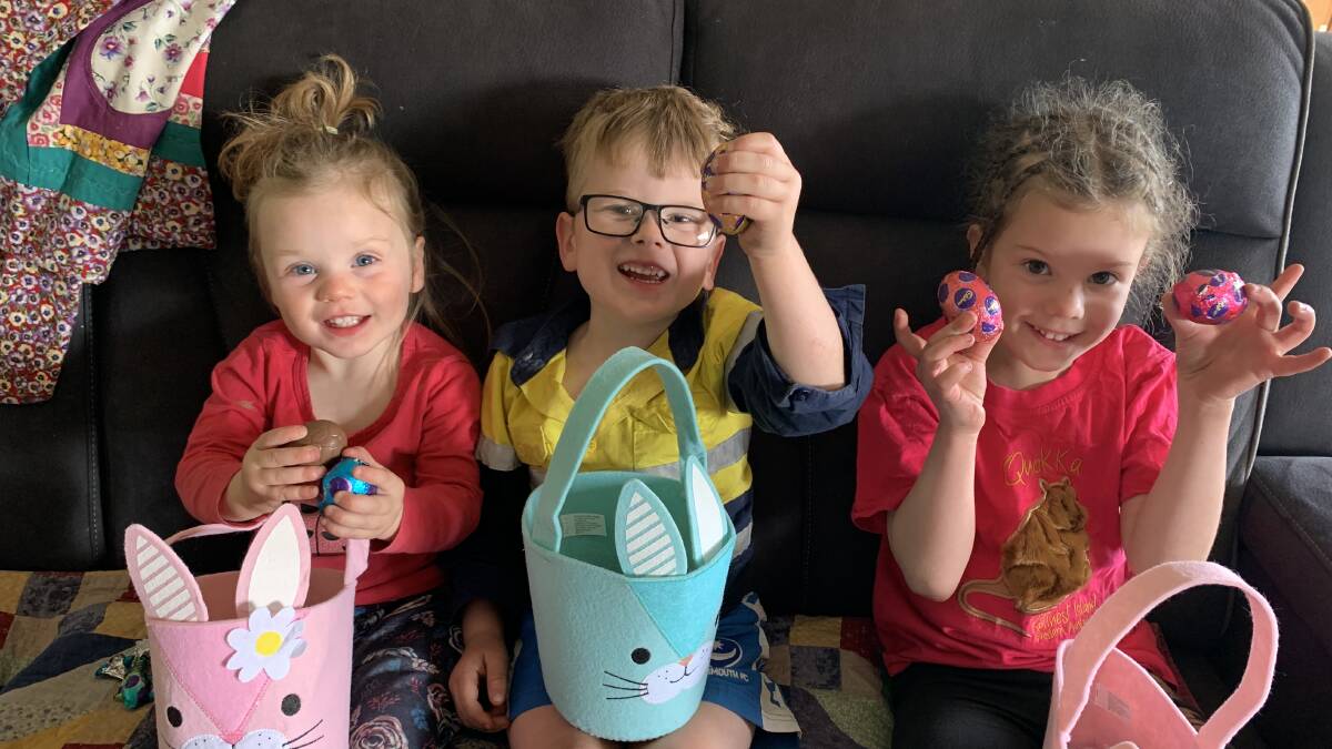 WHAT A HAUL: Emily, Felix and Sophie West with their haul of Easter eggs after their weekend hunt. Photo: SUPPLIED. 