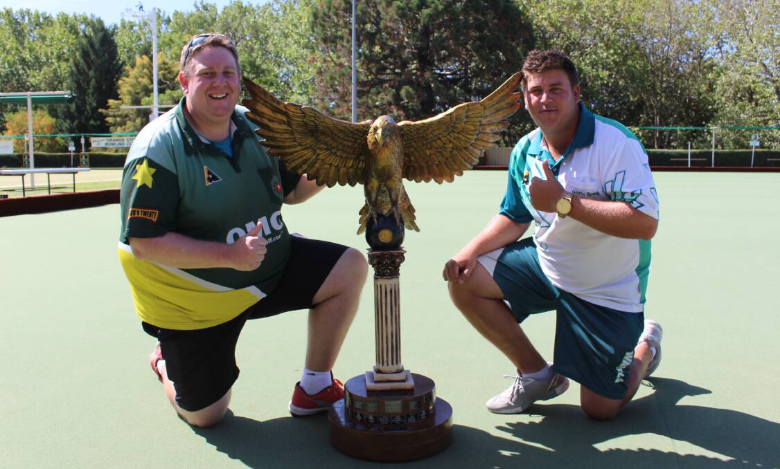THEY'VE GOT IT: Lee Stinson and Corey Wedlock with the gargantuan Orange Eagle trophy after smashing the final with a 29-3 win. Photo: MAX STAINKAMPH