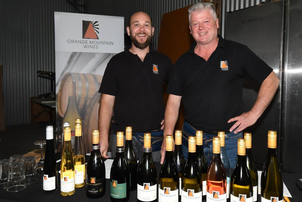 HAPPY CHAPPIES: Chase Johnson and Terry Dolle at Orange Mountain Wines on Saturday night for the winery's Wine Festival event. Photo: CARLA FREEDMAN. 