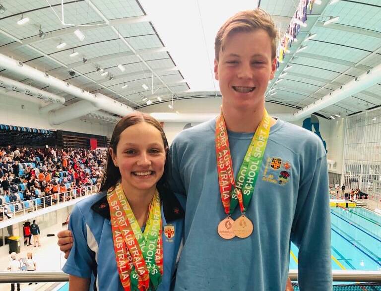YOUNG GUNS: Collette Lyons with Oliver McLachlan at the Melbourne Swimming and Aquatic Centre. Photo: SUPPLIED. 