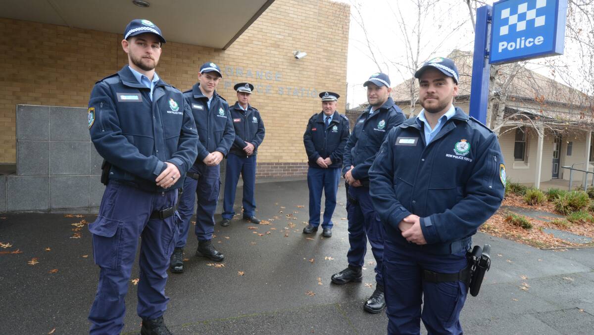 ON THE BEAT: New Central West Police District probationary constables Brock Logue, Jaykob Gavin, Jason Burcher and Matthew Lord on their first day, with Dave Harvey and Central West Police District Chief Inspector Peter Atkins (back). Photo: JUDE KEOGH