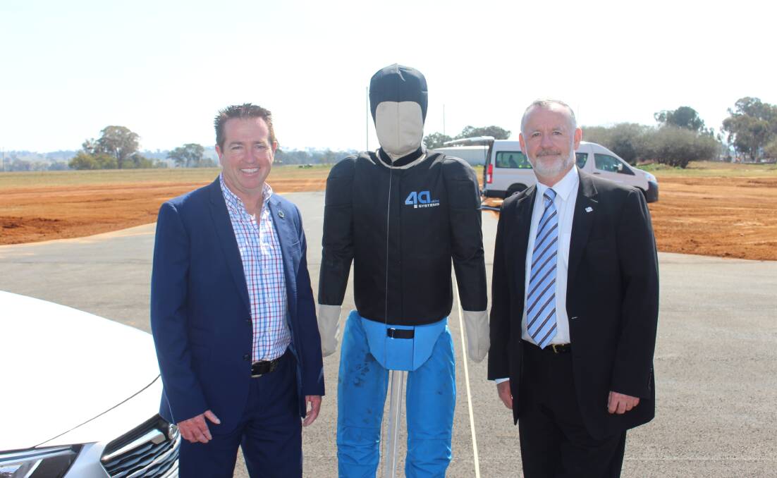 NEW GROUND: Minister Paul Toole with the test dummy and Centre for Road Safety's Bernard Carlon.