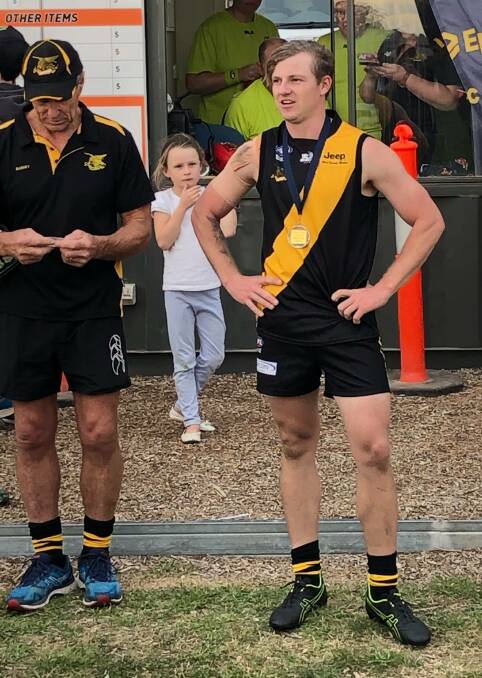 MIDFIELD GUN: Player of the match Logan Crimp being presented with his award by Mark Byrne. Photo: AFL Central West