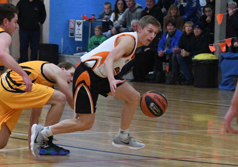 ON THE ATTACK: Eagles' Kobe Mansell collects the loose ball. Photo: JUDE KEOGH