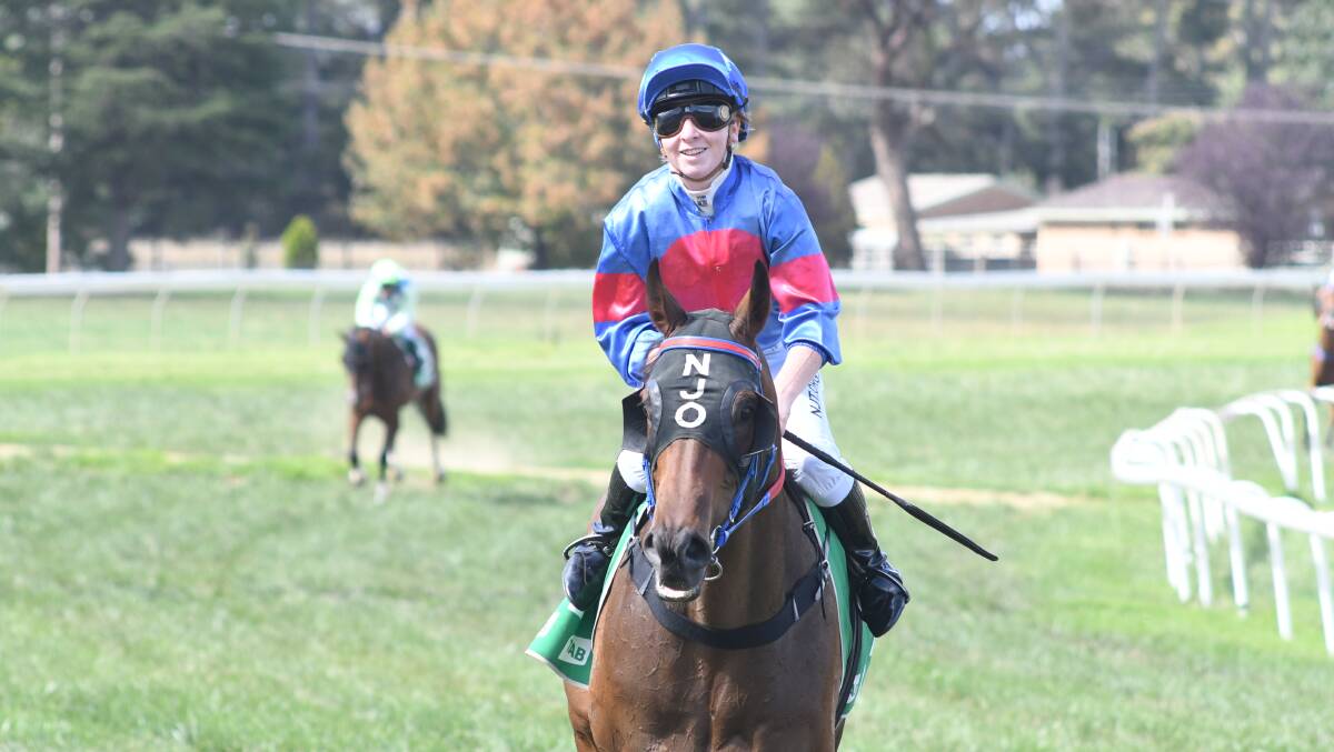 WINNING GRIN: Ellen Hennessy on Contaminated after coming home to claim the win at Towac Park on Saturday.