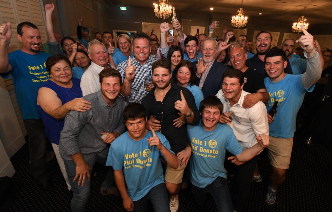 ELATED: Phil Donato surrounded by a crowd of family, friends and supporters on Saturday night at the Canobolas Hotel after claiming victory in the NSW state election. Photo: JUDE KEOGH