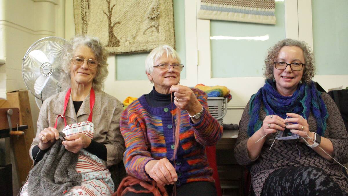 KNITTING UP A STORM: Orange Spinner and Handicraft Group's Sharelle Cartwright, Dawn Williams and Clivia Frieden in action. Photo: MAX STAINKAMPH 0530MSfibre. 