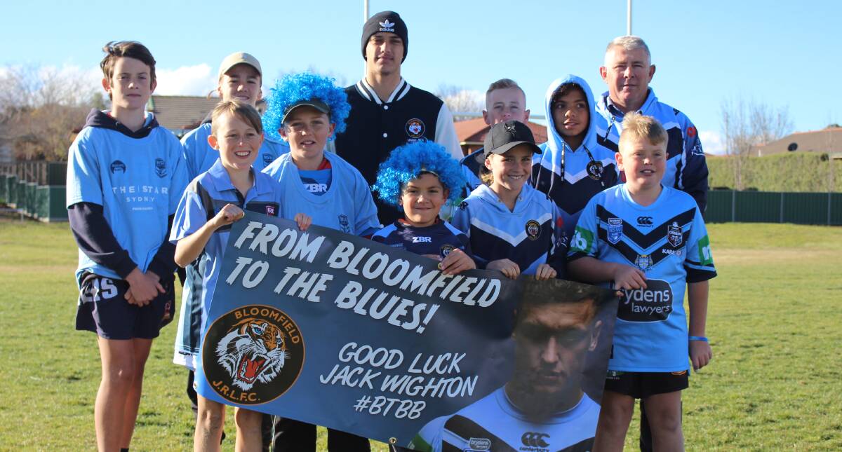 BACKING JACK: Some of the contingent of 50 Bloomfield Tigers heading to the State of Origin decider on Wednesday night. Photo: MAX STAINKAMPH