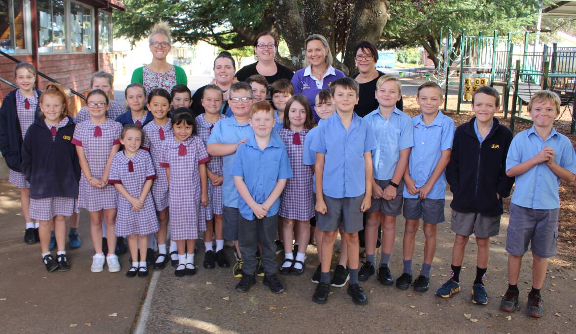SUPPORTING: Tracey Press (in the purple) with teachers and students at Orange East Public School. Photo: MAX STAINKAMPH
