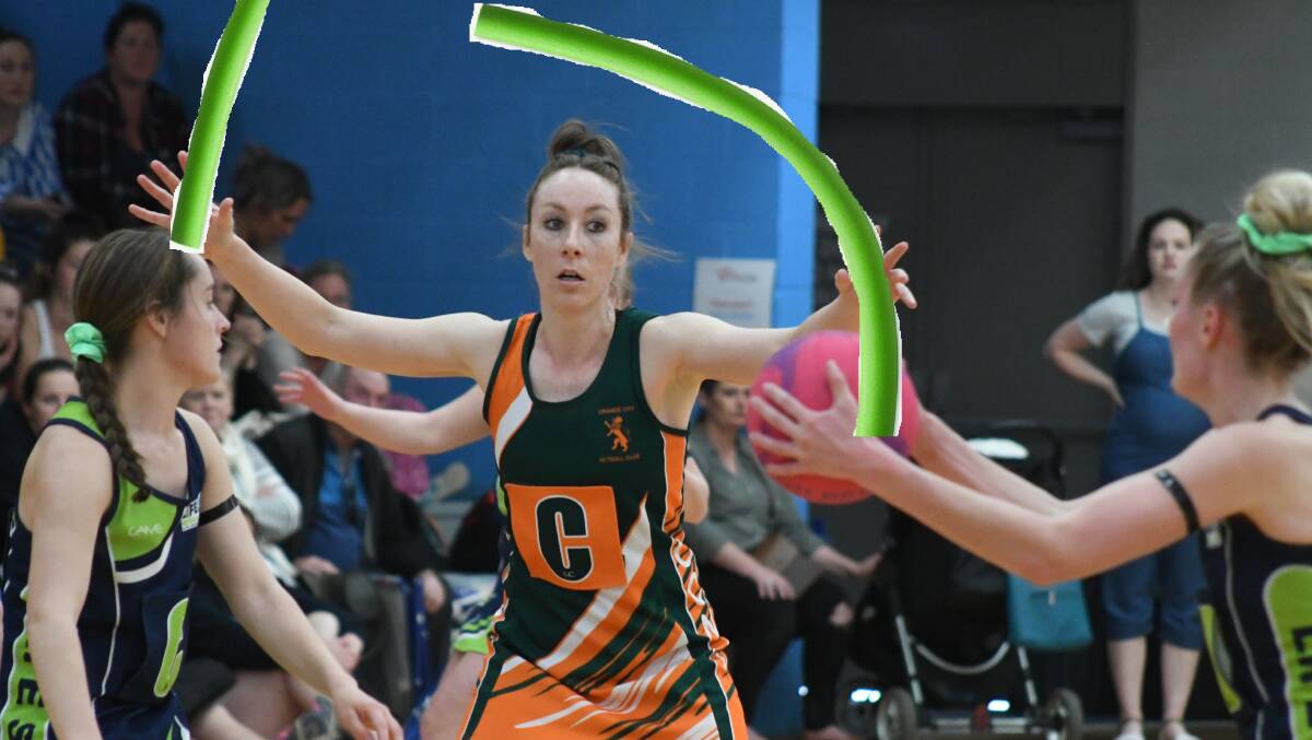 STRONG DEFENSIVE GAME: Tegan Dray with the strong double-noodle defence in the Orange Netball Association's opening round, or at least how we image it. Photo: DIGITALLY ALTERED IMAGE
