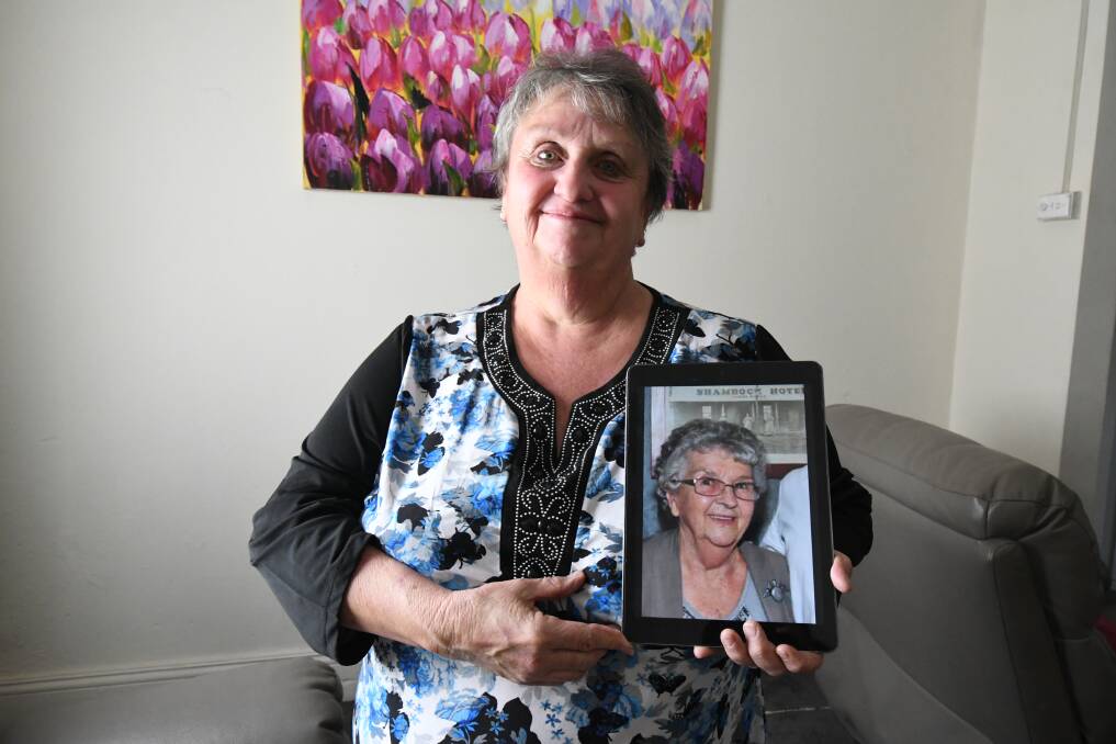 FIGHTING ON: Vicki Baker with a photo of her mother Daphne, who died from Sepsis last year. Photo: JUDE KEOGH